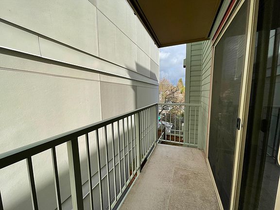 Spacious deck, please note the living room and primary bedroom face the neighboring building. This 2 bedroom provides excellent privacy in a bustling city.