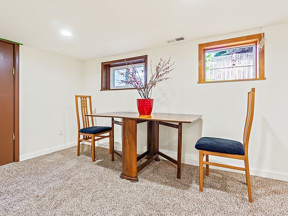 Enter apartment through this brown door.
Apartment comes with an oak table and chairs - if the new tenant wants.