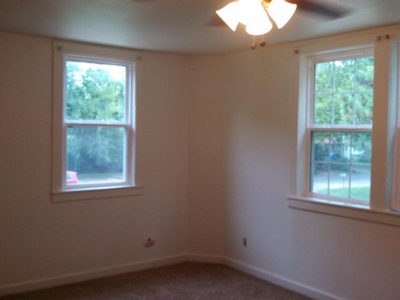 Living room with new flooring and windows. Lots of natural light.