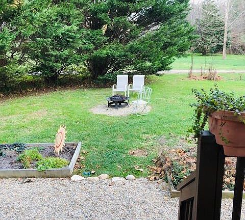 View from side door and porch Your own firepit and garden bed