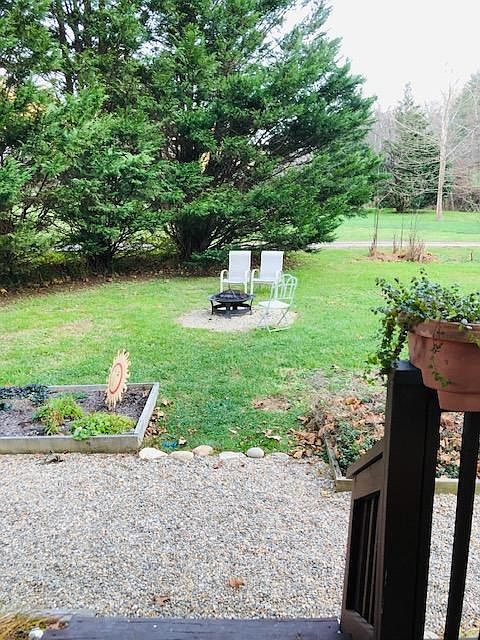 View from side door and porch Your own firepit and garden bed