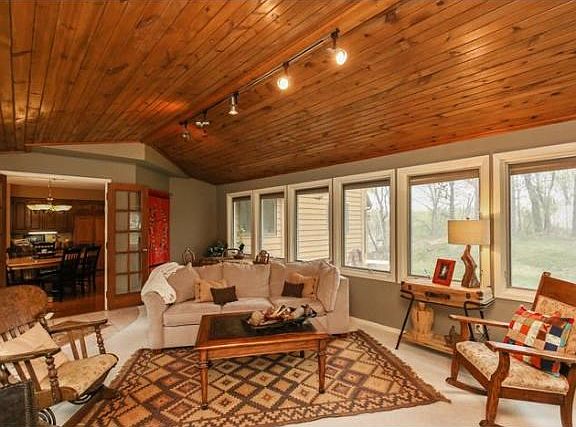 This 4-season porch is AWESOME!  Vaults with wood tongue in groove cedar.  ALL new windows in this room.