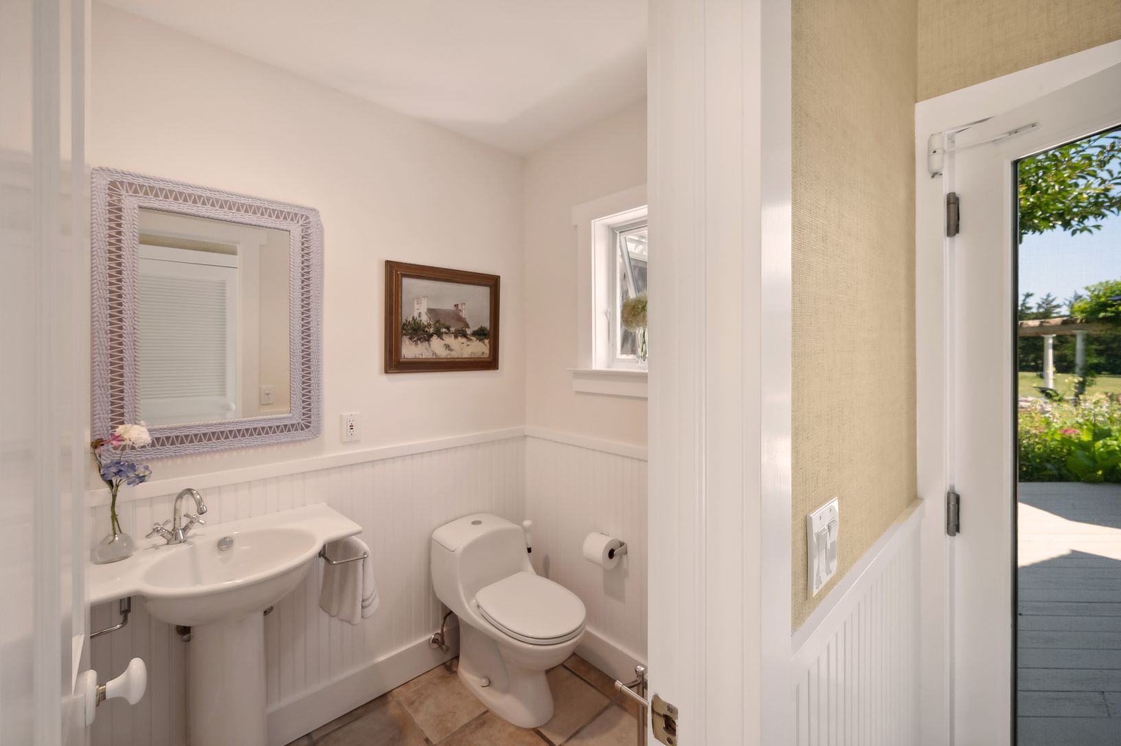 Entry way Powder Room across hall from Laundry Area, centrally located