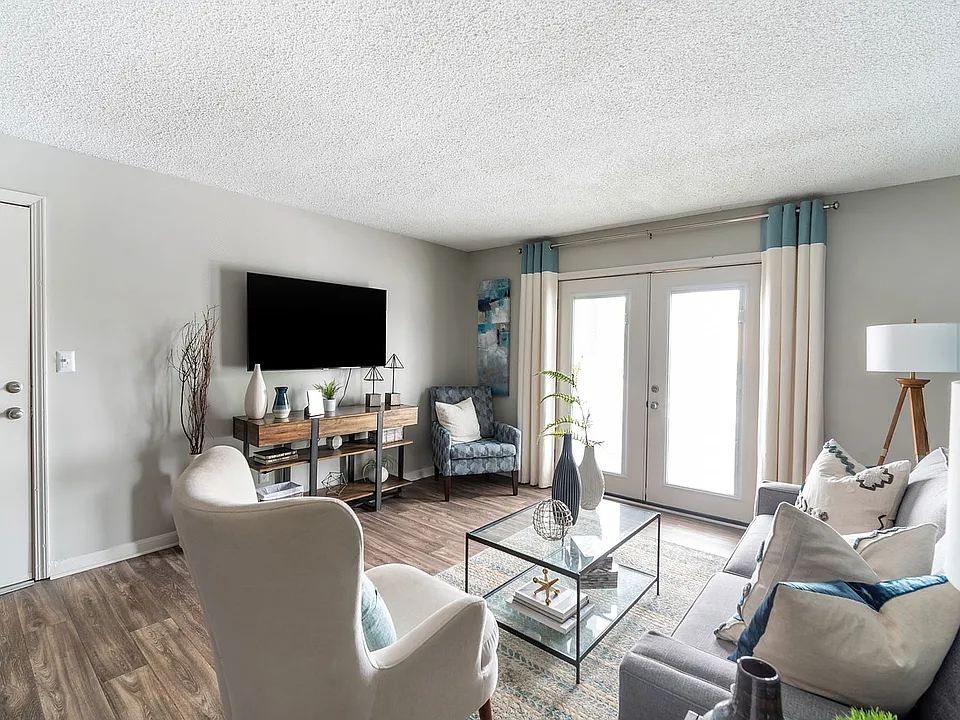 Spacious living room with hardwood-style flooring