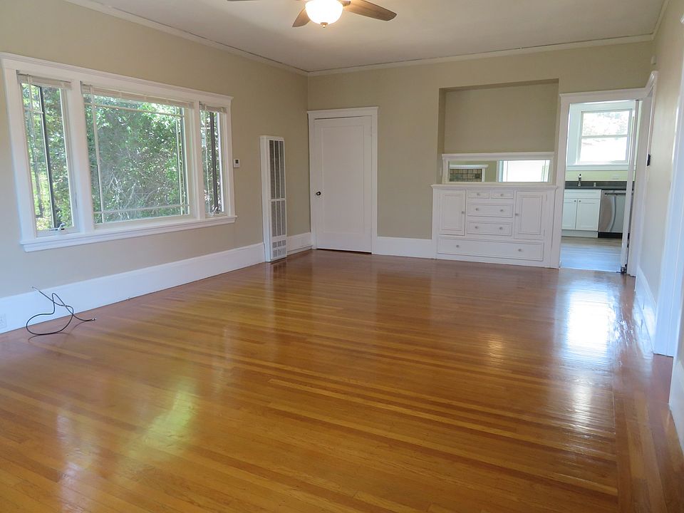 Living room/dining area with built in shelving