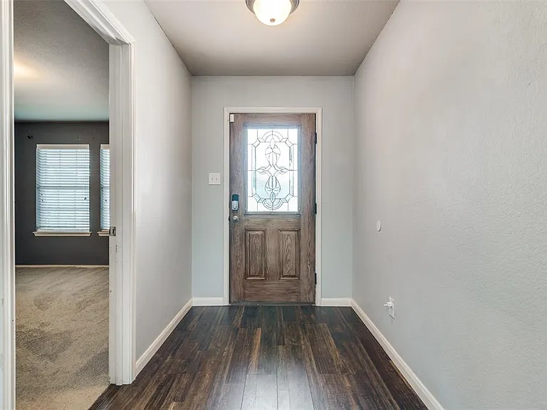 View of carpeted entrance foyer