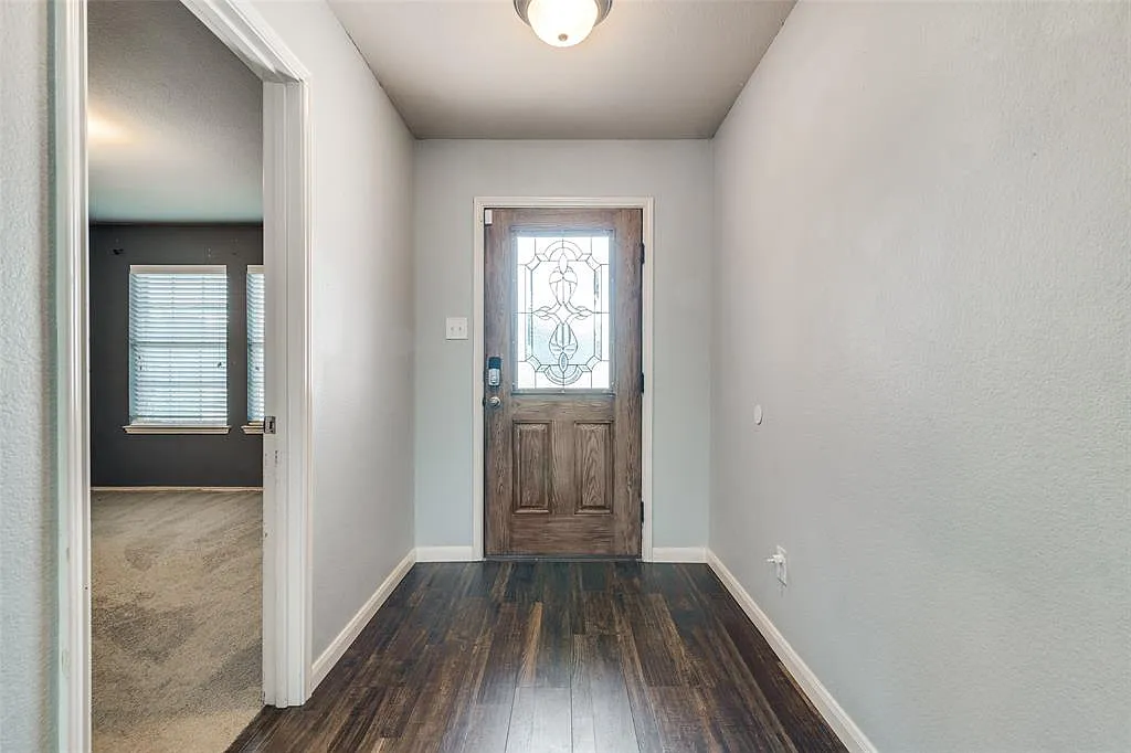 View of carpeted entrance foyer - 707 Windflower Dr