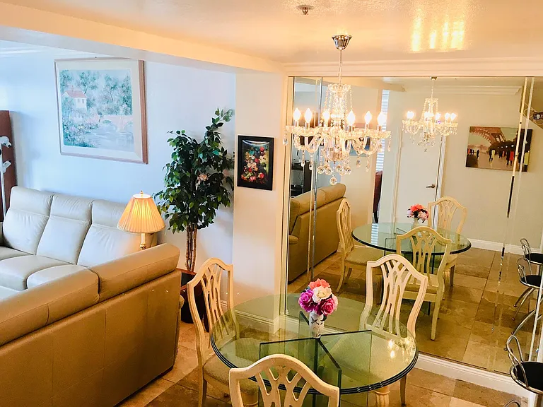 Ocean front Open floor plan: New chandelier in front of new mirrors in July 2019.