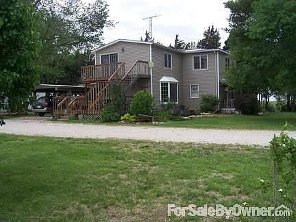 two story deck
						:
						Deck on east side goes up to Master bd. Bay window on front is new last year.