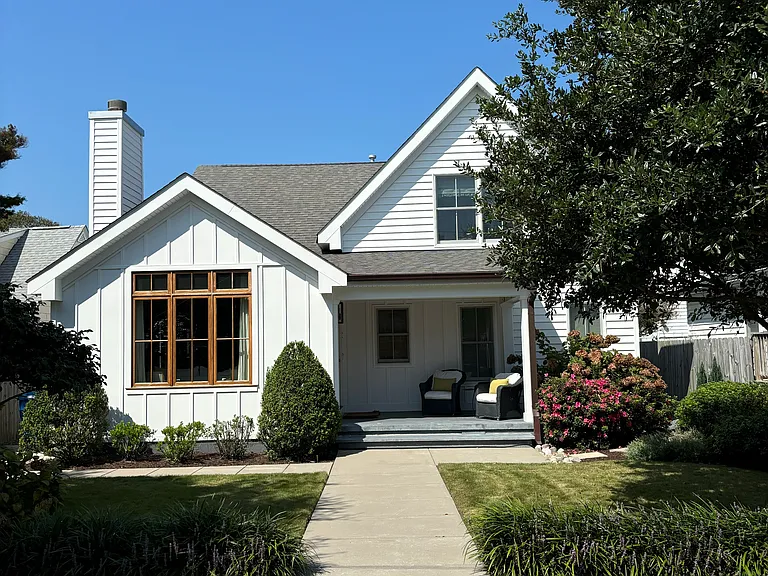 Enjoy Southern exposure and lively neighborhood from front porch