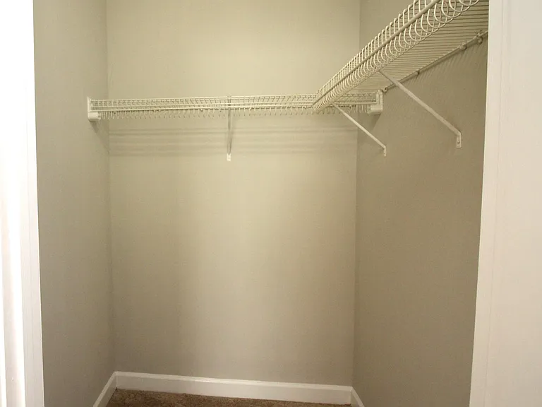Walk in closet in primary bedroom