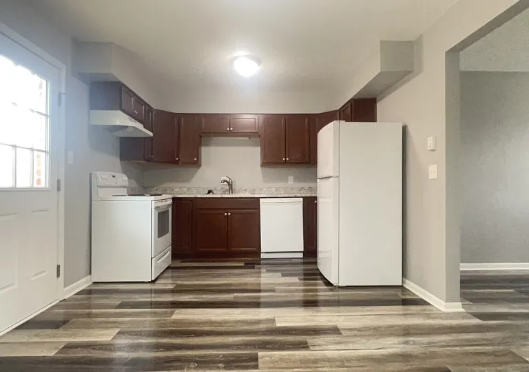 Kitchen Area with access to back Patio/Balcony