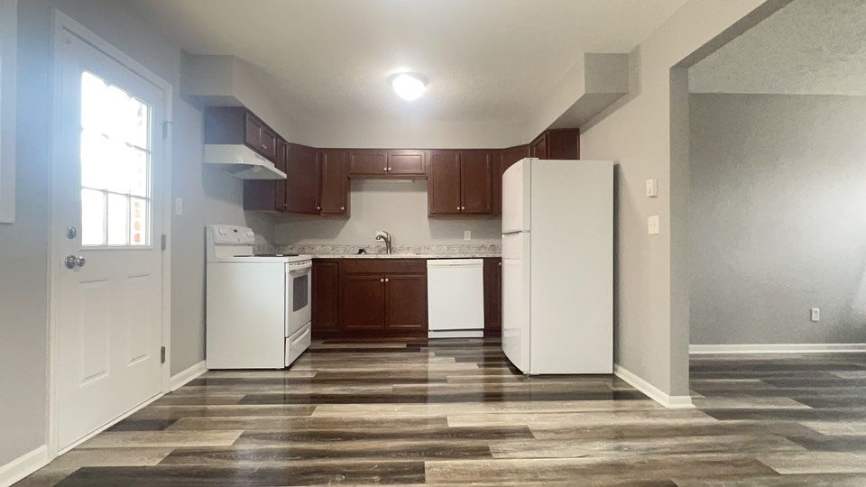 Kitchen Area with access to back Patio/Balcony