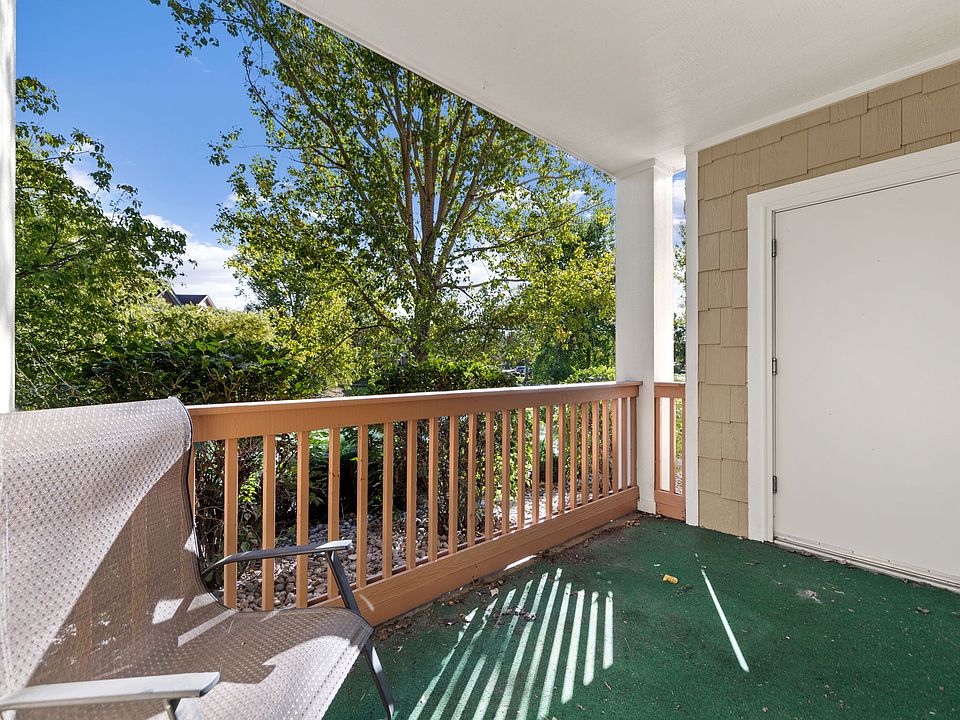 Quiet patio with view of pond and mature landscaping with large storage closet