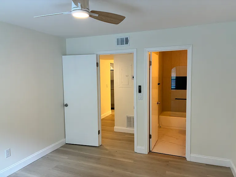 Master bedroom with a private renovated 
master bathroom