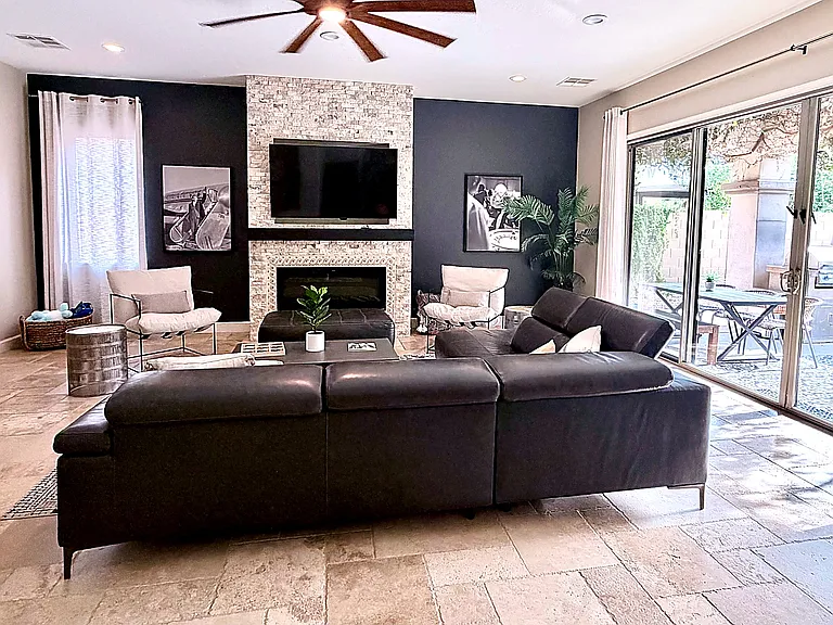 Living room open to kitchen, patio and dining room