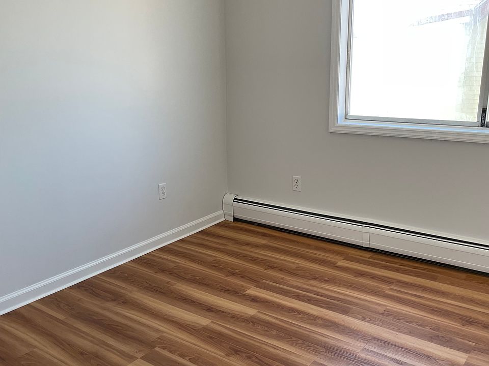 Bedroom has large window.