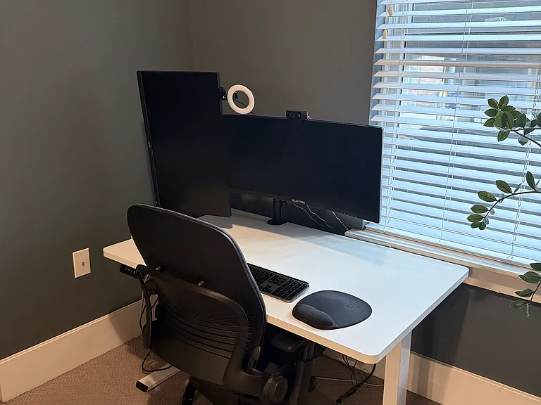 Workstation with dual monitors, Steelcase chair and standing desk