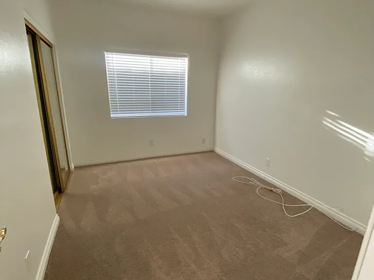 Bedroom #3 - Full length mirrored closet doors, ceiling fan.