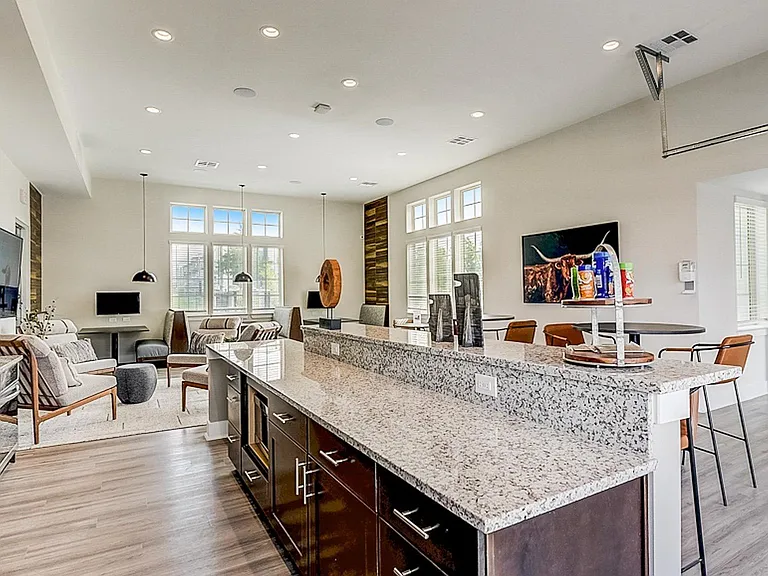 Open and airy community lounge with pool views