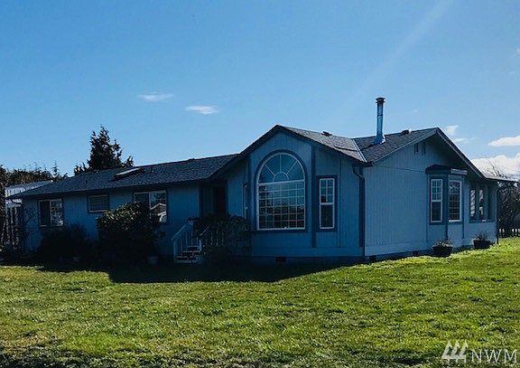 Home is oriented on the lot with RV & boat parking in back so they don't interfere with views. Note new roof.