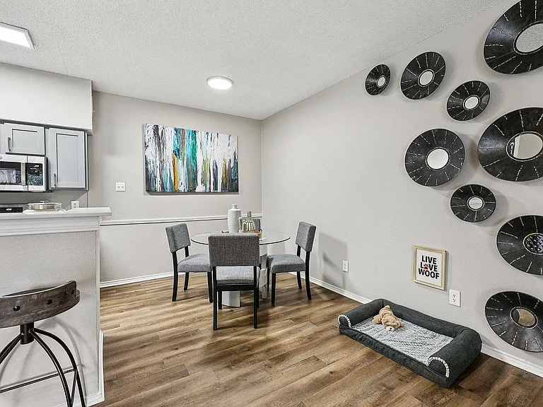 Enjoy a bright and inviting dining room, perfect for meals and entertaining at Collin Creek Apartments in Plano.