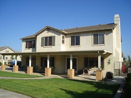 Patio extends 50+ foot across back of home