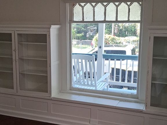 This available bedroom has a lovely bay window area with original decorative window and built-in bookcases.