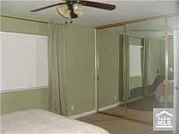Large Master Bedroom with Floor to Ceiling Mirrored Wardrobe Doors