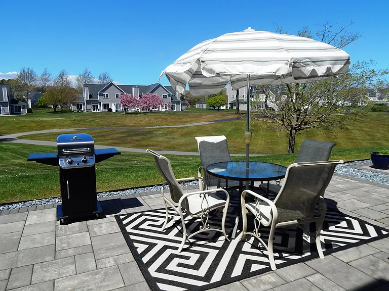 private patio abuts 14th fairway. Propane gas and electric grills available for tenant's use