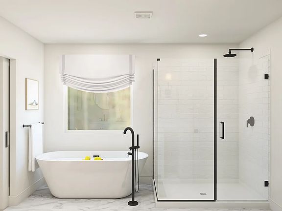 Primary bath with freestanding tub glass-shower enclosure