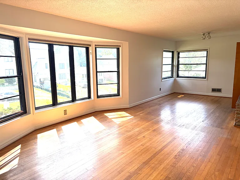 living room with additional open room adjoining