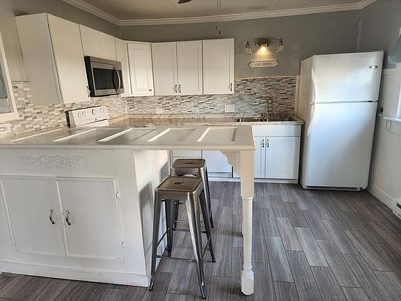 View into kitchen. Lots of storage and prep space for a single tenant and some guests!