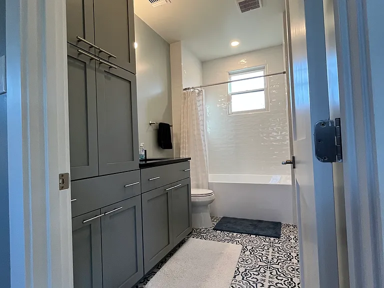Full bathroom with ample storage