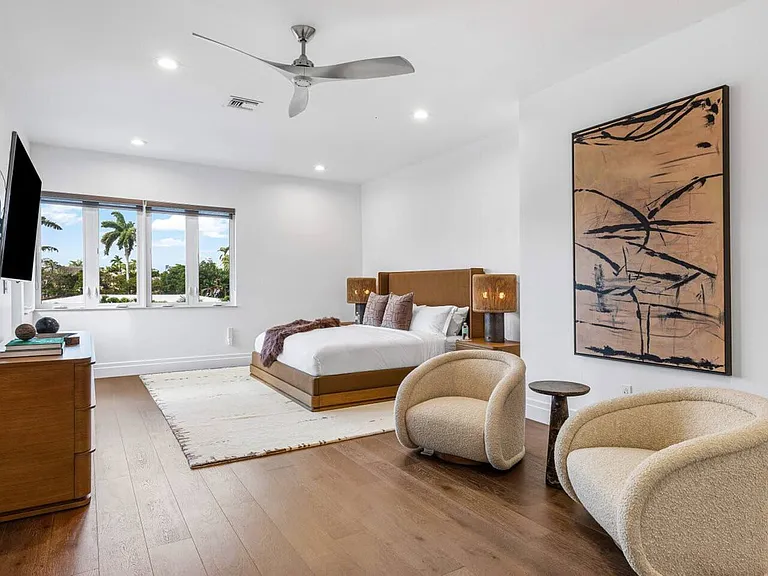Spacious master suite with private balcony access for serene mornings.
