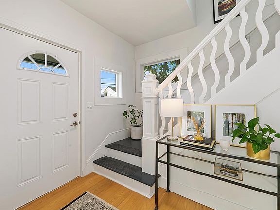 Front door on main floor. Stairs lead to upper level where master bed, master bath, 2nd bedroom, and laundry are located.