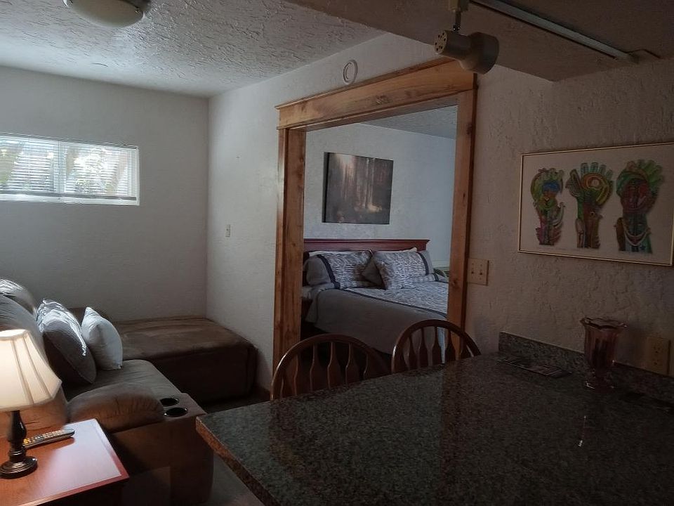 The Current Living Room Couch is a Double Recliner with Center Console.
The Photo shows a lounge couch of suede which is currently in very hip Apartment #1 on property.

The King Bed is always restocked with all new bedding.