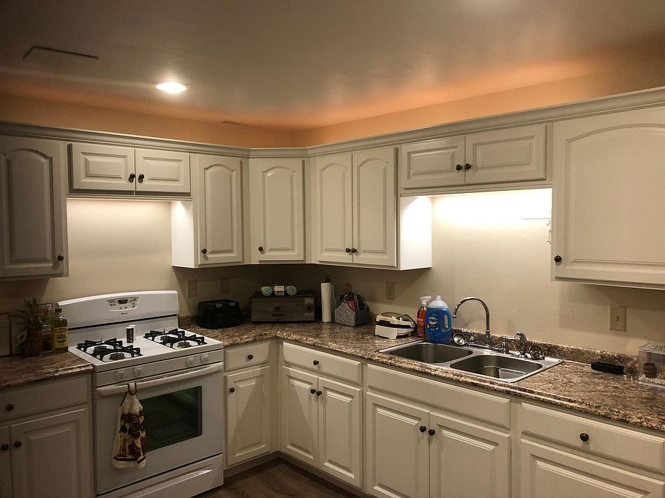 space above cabinets for plants or decorations.