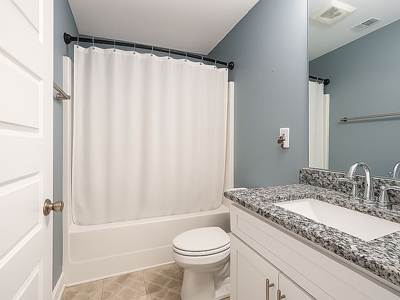 You own, private bathroom includes a shower and tub.