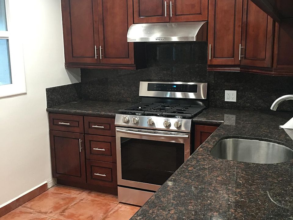 Kitchen with all new appliances Lots of storage in the newer cabinetry Granite countertop