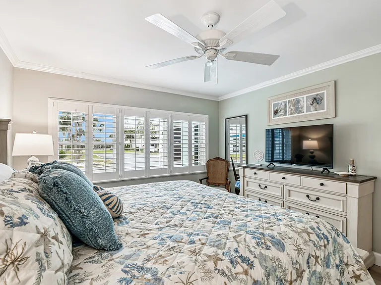 Primary Bedroom - wooden shutters on every window