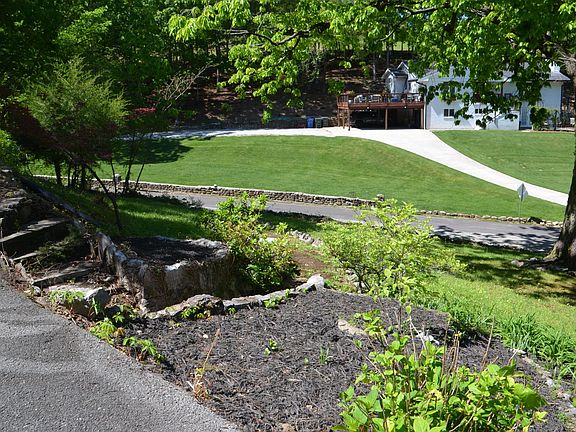 Looking down front yard. There's a little stone path you take to the mailbox.