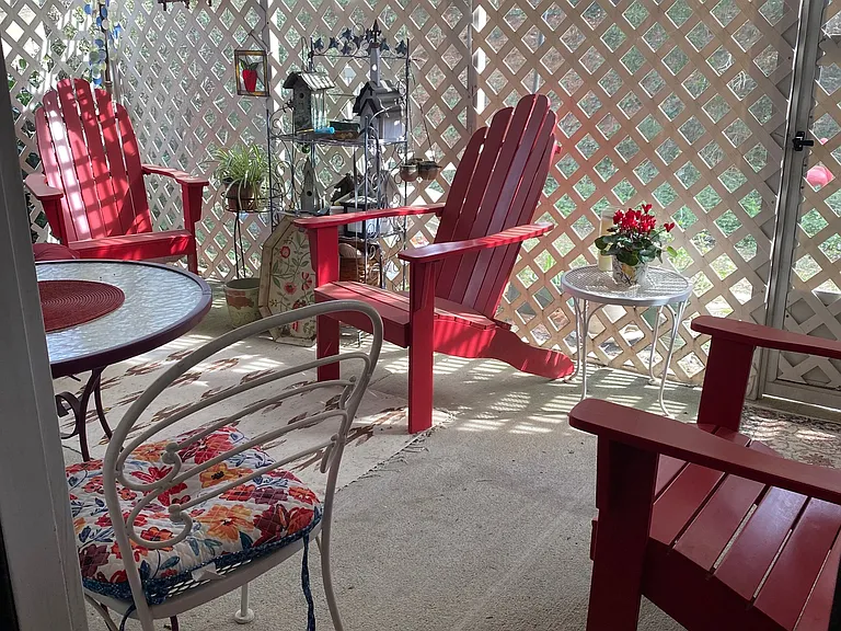 Screened porch, private, looks onto small yard with trees