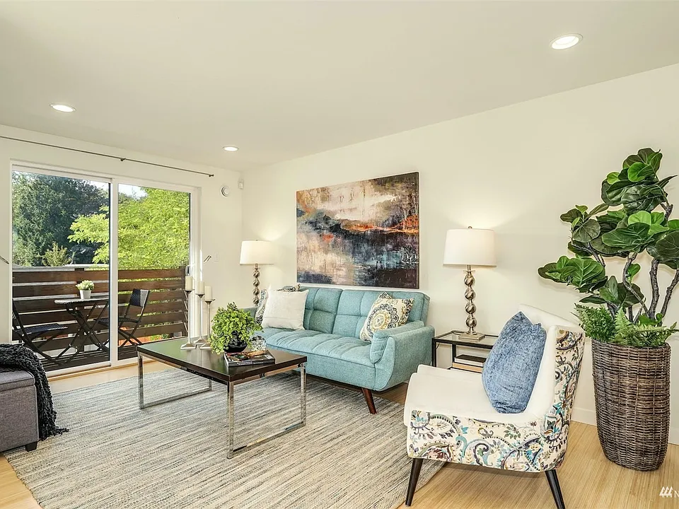 Living room with bamboo flooring and sunny southern exposures.>