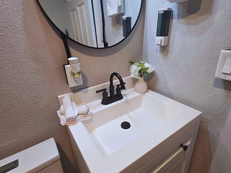 Elegant vanity with decorative floral arrangements