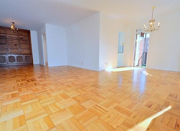 Bright and sunny foyer, living room and dining area have refinished parquet floors and overlooks tree lined Garth Road.  There is a door that leads to a private screened in balcony with Southern exposures.  The living roo is 20'-1" x 12'-0" the dining are