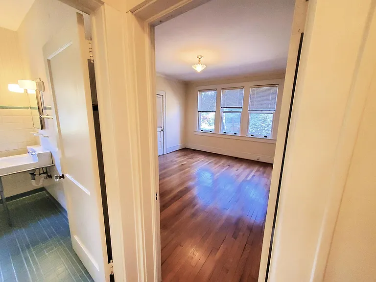 a Master Bedroom next to the Hall Bath with entry to attached Sunroom