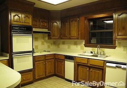 Kitchen
						:
						In Kitchen and throughout house are solid oak cabinets.
