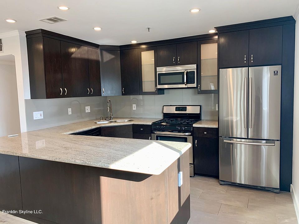Beautifully Upgraded Kitchen with tons of Counter Space, Stainless Steel Appliances and Custom Cabinets