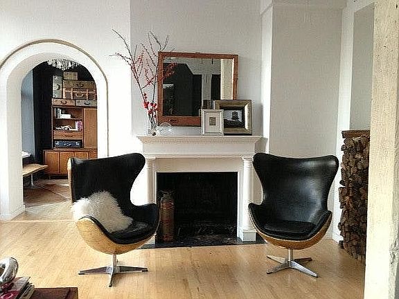 Entry and Living Room (w/ wood burning fireplace).